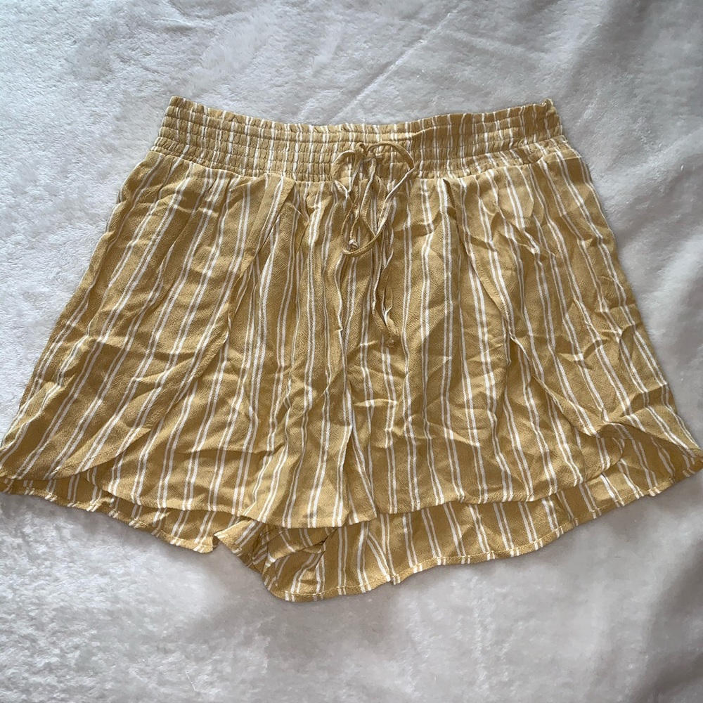 Yellow paper bag American eagle shorts.